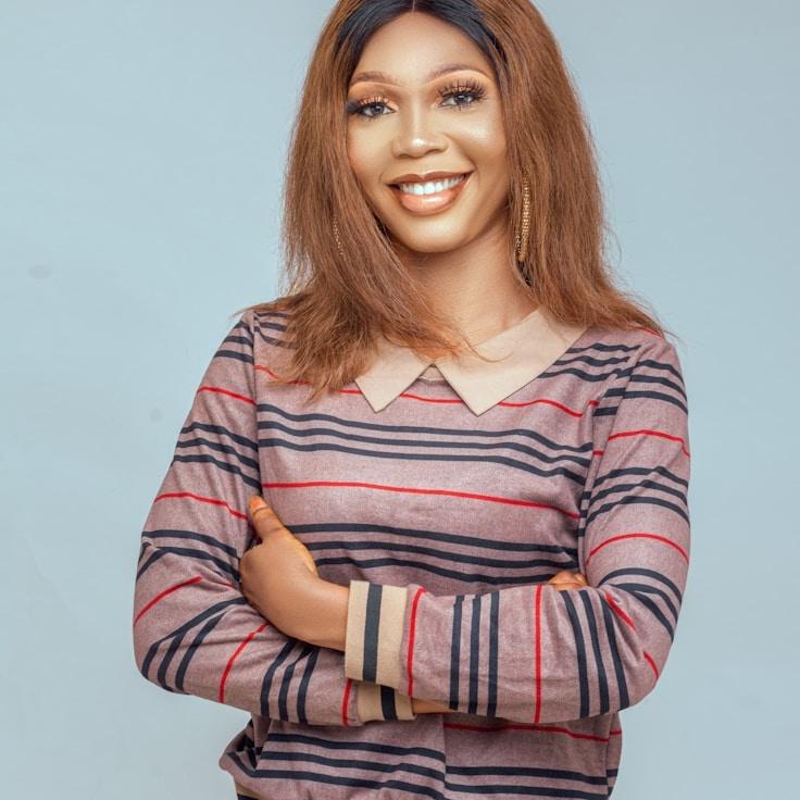 Kaveri Mehta, Lead Design Curator at Orbit Roam Grand, reviewing corporate floral arrangements